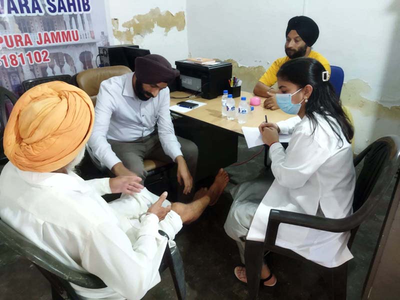 Doctor examining the patient during a medical camp at Central Gurudwara, RS Pura in Jammu. Doctor examining the patient during a medical camp at Central Gurudwara, RS Pura in Jammu.
