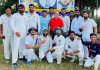 Team displaying trophy while posing for a group photograph at Nagbani Jammu.