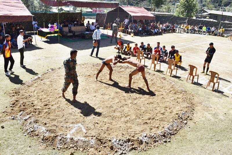 Wrestlers in action during a bout in Rajouri on Thusday. Wrestlers in action during a bout in Rajouri on Thusday.