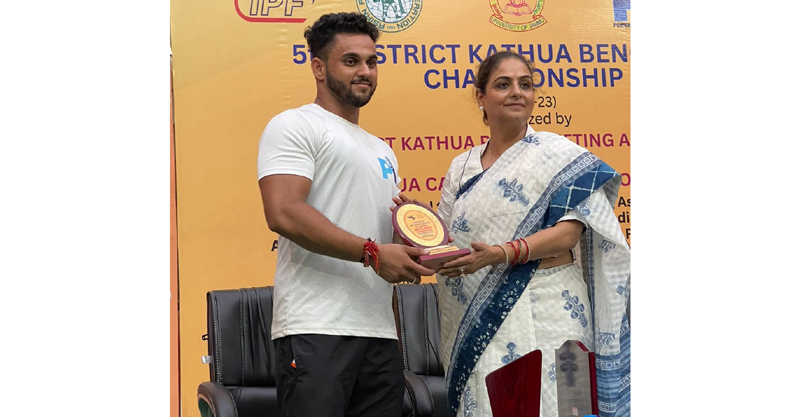 A winner being awarded with trophy by a dignitary at Kathua on Friday.