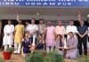 Winners displaying trophies while posing with dignitaries at Udhampur on Saturday.