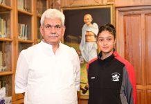 Gold Medallist Sadia Tariq posing with LG Manoj Sinha at Raj Bhawan Srinagar on Friday.