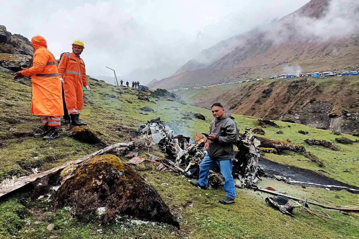Security personnel and locals during search and rescue operation after a chopper carrying pilgrims crashed at Garud Chatti near Kedarnath shrine on Tuesday. (UNI) Security personnel and locals during search and rescue operation after a chopper carrying pilgrims crashed at Garud Chatti near Kedarnath shrine on Tuesday. (UNI)