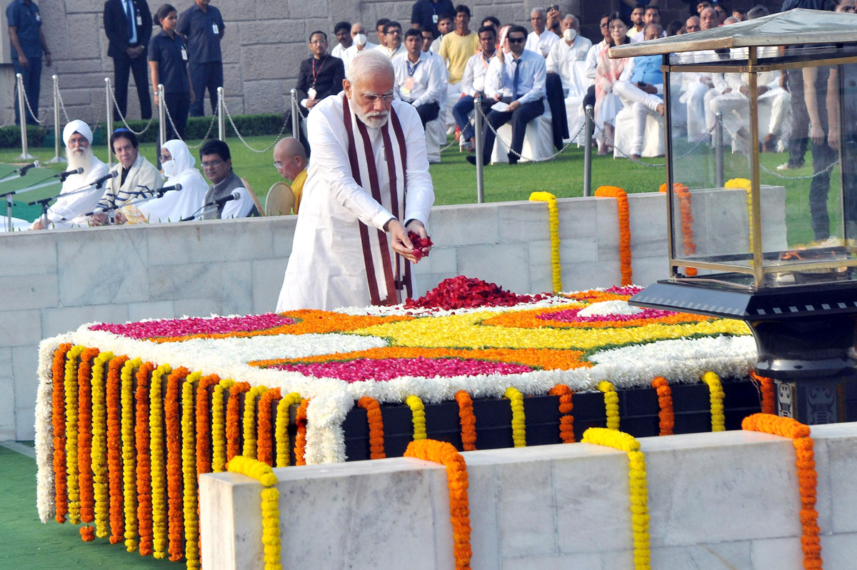 Prime Minister Narendra Modi paying floral tributes at the Samadhi of Mahatma Gandhi on his 153rd birth anniversary, at Rajghat, in Delhi on Sunday. (UNI)