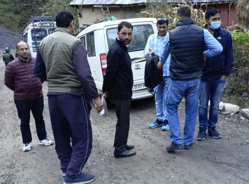 The NIA team near the house of suspect in Mandi, Poonch on Friday. -Excelsior/Wasim The NIA team near the house of suspect in Mandi, Poonch on Friday. -Excelsior/Wasim