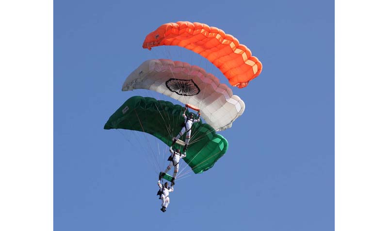 Akash Ganga sky diving team of the IAF displaying their skills during diamond jubilee at Air Force Station Udhampur. -Excelsior/Rakesh