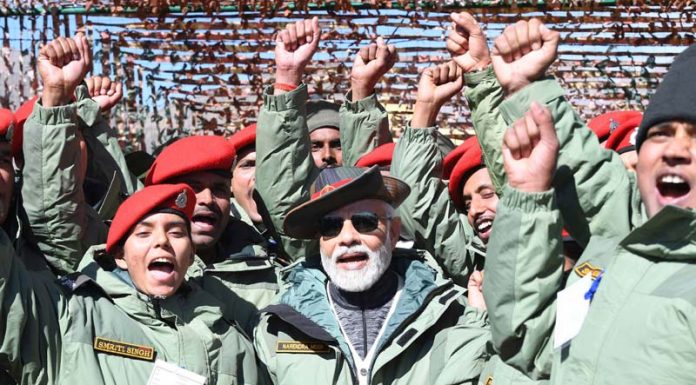 Prime Minister Narendra Modi with soldiers in Kargil on the occasion of Diwali. (UNI)