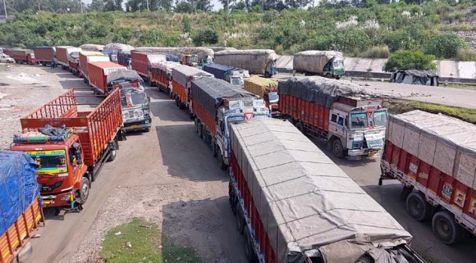 Long queues of trucks stranded due to traffic jam on Jammu-Pathankot NH at Lakhanpur on Friday. -Excelsior/Pardeep