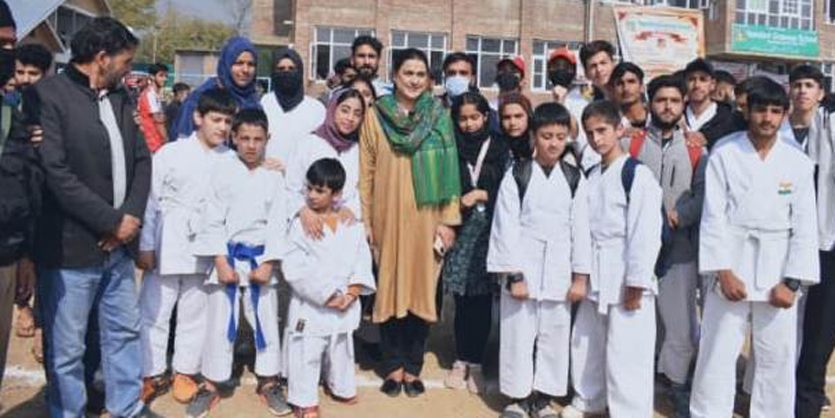 Secy Sports Council, Nuzhat Gull posing for a group photograph with players at Tral on Thursday. Secy Sports Council, Nuzhat Gull posing for a group photograph with players at Tral on Thursday.