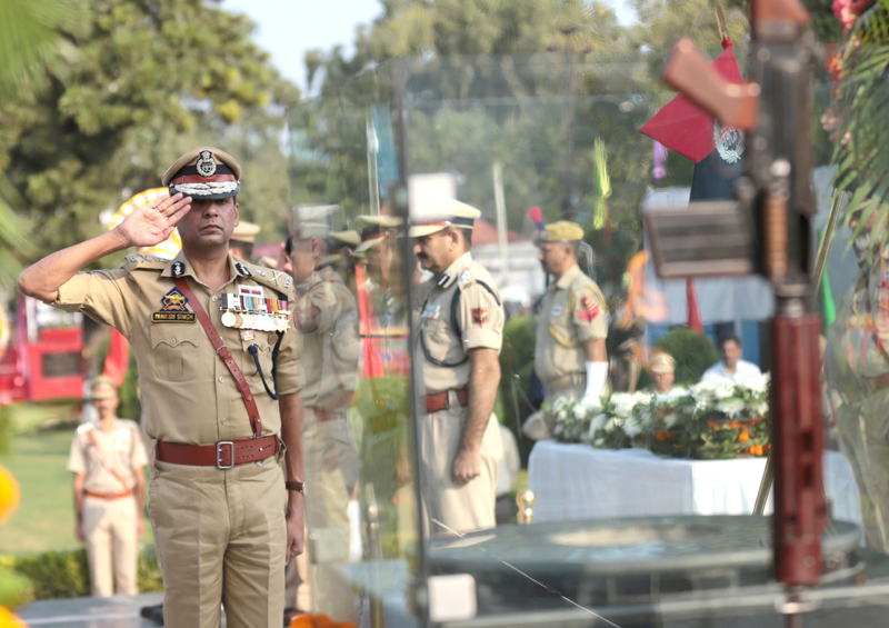 Mukesh Singh, Additional Director of Police Jammu Zone, Jammu taking salute of Commemoration Day Parade at Gulshan Ground, Jammu. -Excelsior/Rakesh Mukesh Singh, Additional Director of Police Jammu Zone, Jammu taking salute of Commemoration Day Parade at Gulshan Ground, Jammu. -Excelsior/Rakesh