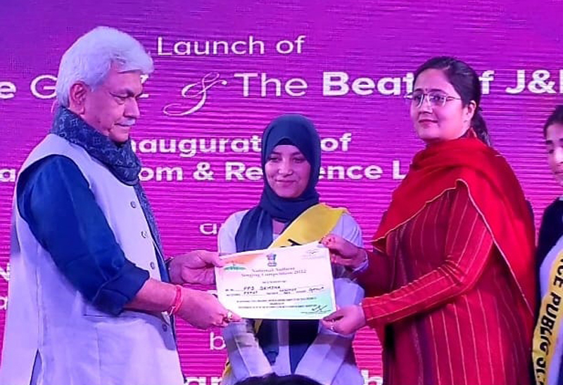LG Manoj Sinha giving first prize to Police Public School Bemina Principal Snigdha Singh on Friday. LG Manoj Sinha giving first prize to Police Public School Bemina Principal Snigdha Singh on Friday.