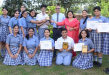 Students of KCPS displaying meritorious certificates while posing with school management at Jammu on Monday.
