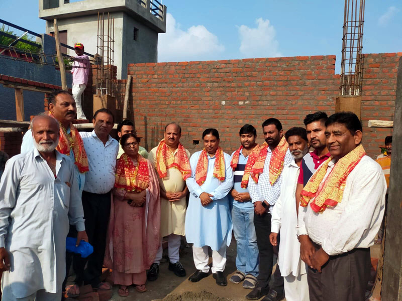 Former Minister Sat Sharma along with others during construction work of Community Hall. Former Minister Sat Sharma along with others during construction work of Community Hall.