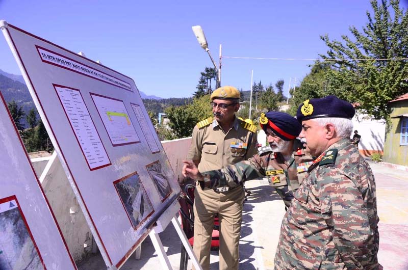 Chief Engg, Project SAMPARK, Brig Tej Pal Singh, showing DPR of a project displayed on board to visiting DG BRO, Lt Gen Rajeev Chaudhary in Bhaderwah area of district Doda. -Excelsior/Tilak Raj Chief Engg, Project SAMPARK, Brig Tej Pal Singh, showing DPR of a project displayed on board to visiting DG BRO, Lt Gen Rajeev Chaudhary in Bhaderwah area of district Doda. -Excelsior/Tilak Raj