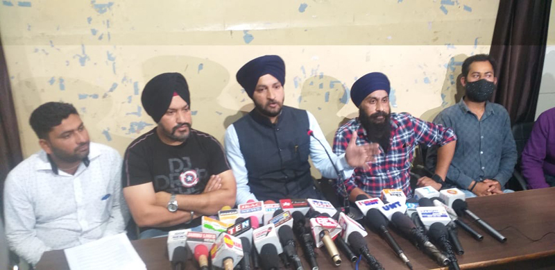 Members of e-Rickshaw Union addressing a press conference at Jammu on Wednesday. Members of e-Rickshaw Union addressing a press conference at Jammu on Wednesday.
