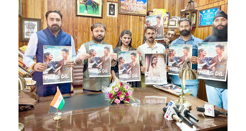 Ikkjut Jammu president Ankur Sharma along with Dogri singer Ridhi Bhagat and others releasing poster of new Dogri song 'Mere Dil'.