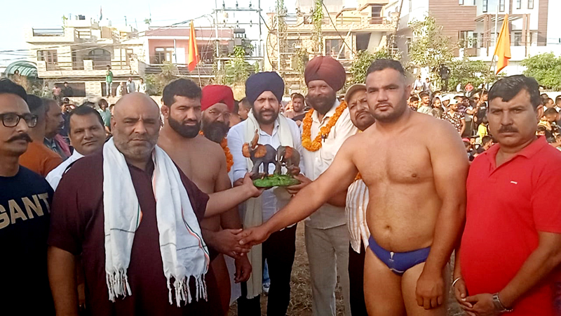 BJP leader, Dr Narinder Singh Raina awarding the winner at RS Pura along with others on Wednesday. BJP leader, Dr Narinder Singh Raina awarding the winner at RS Pura along with others on Wednesday.