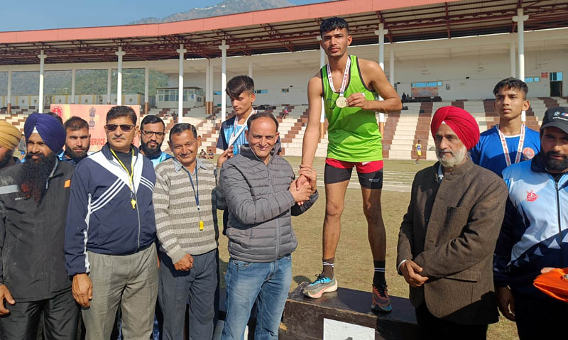 A winner being awarded with medal by the officials of Youth Services and Sports at Reasi on Tuesday.