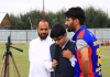 Musaib delivers commentary during a local cricket match at Sopore.