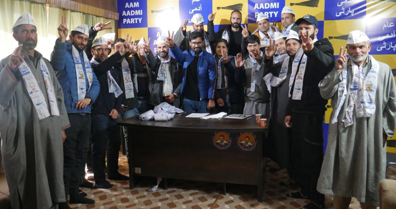 AAP leaders posing with new entrants of the party during a function in Srinagar. AAP leaders posing with new entrants of the party during a function in Srinagar.