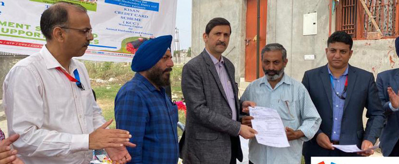 J&K Bank officer handing over loan sanction letter to a beneficiary. J&K Bank officer handing over loan sanction letter to a beneficiary.