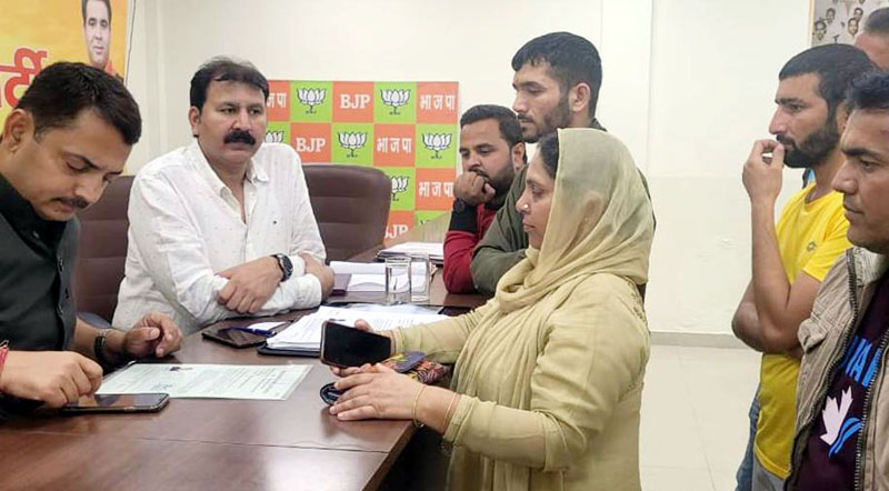 BJP leaders listening public grievances at Jammu on Tuesday. BJP leaders listening public grievances at Jammu on Tuesday.