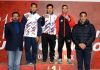 Winners displaying medals while posing with officials including Kuldeep Handoo, National Coach at Srinagar on Tuesday.