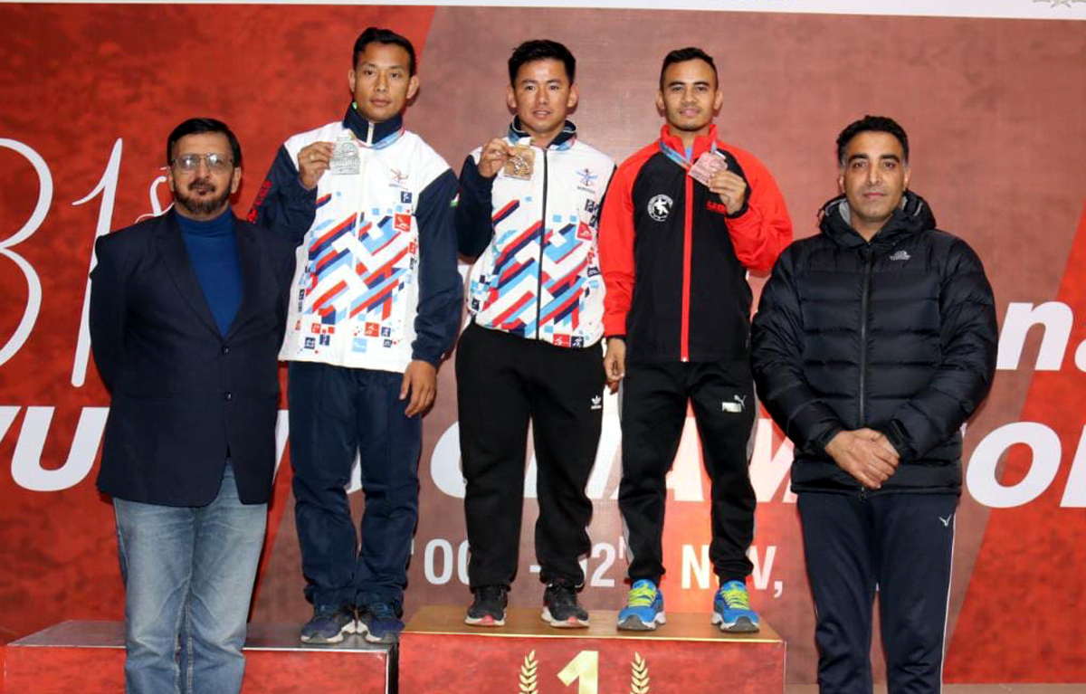 Winners displaying medals while posing with officials including Kuldeep Handoo, National Coach at Srinagar on Tuesday. Winners displaying medals while posing with officials including Kuldeep Handoo, National Coach at Srinagar on Tuesday.