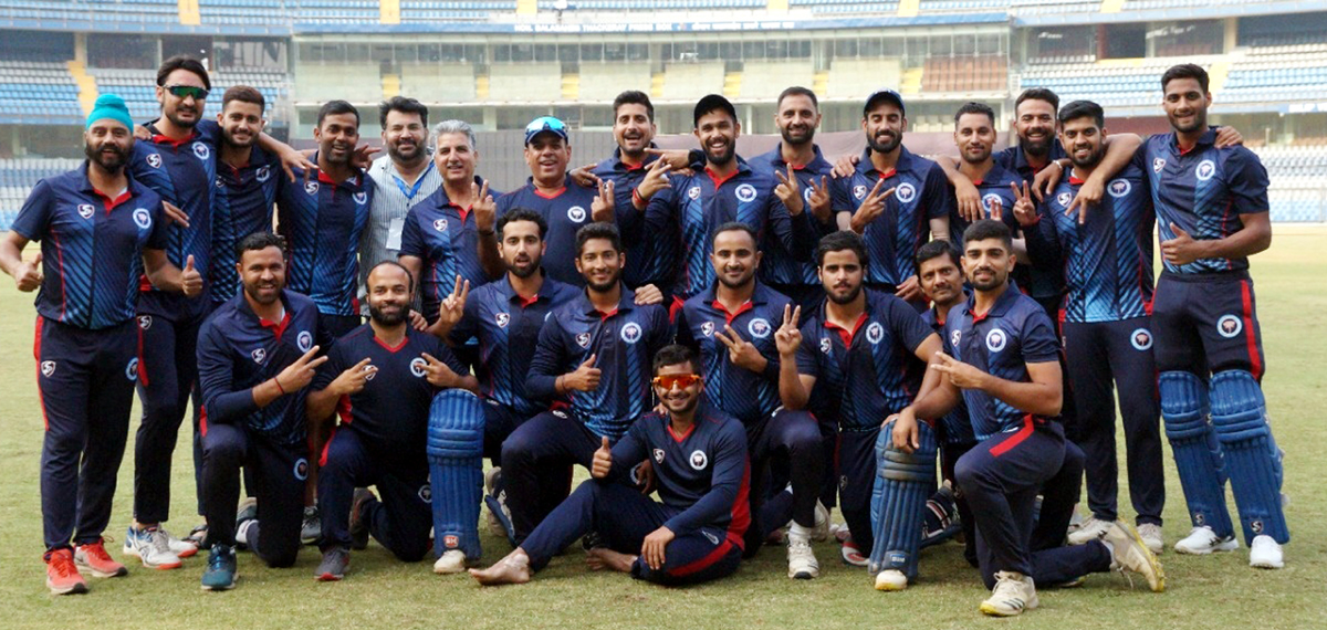 J&K team posing alongwith support staff at Wankhede Stadium in Mumbai on Wednesday.