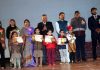 Meritorious students posing with dignitaries during ‘Annual Day’ function of Pushp Vatika at Jammu on Monday.