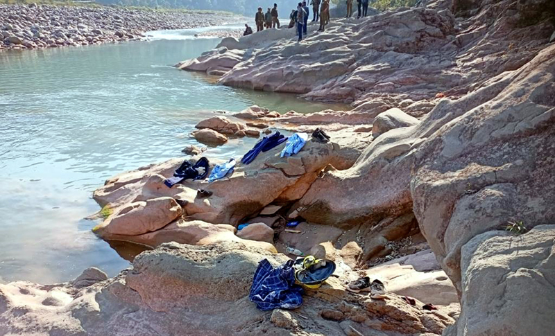 Police and locals searching the dead bodies of students from river Bhinni in Billawar on Friday.