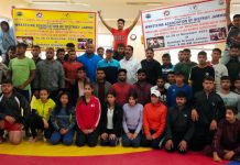 Wrestlers posing for a group photograph at Gulshan Ground Jammu on Saturday.