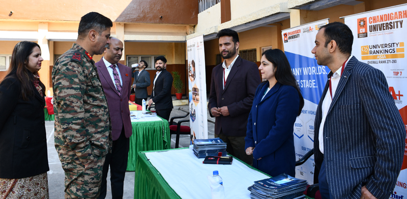 Chief guest Major Gen S S Patil interacting with representatives of different universities during ‘Career Fair’ at APS Udhampur on Saturday.