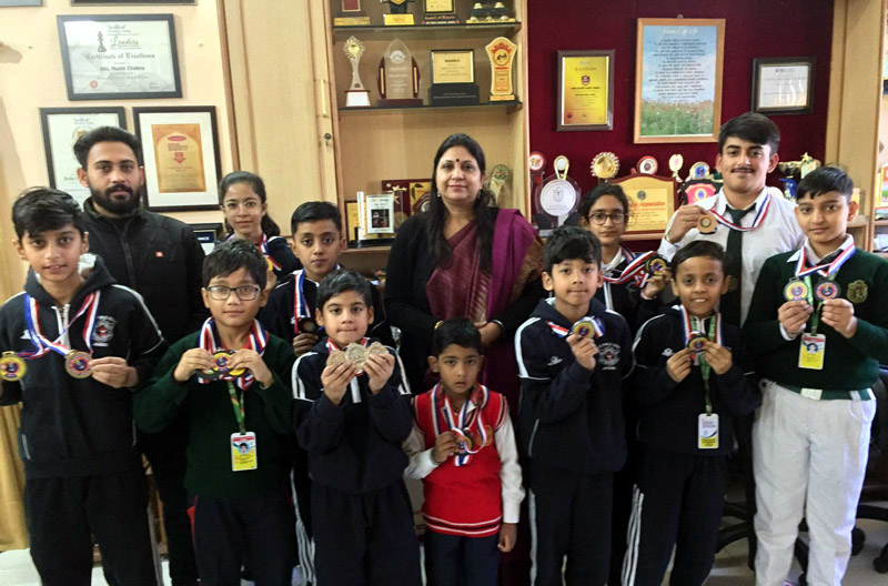 Winners displaying medals while posing with school Principal and others at DPS Jammu on Monday. Winners displaying medals while posing with school Principal and others at DPS Jammu on Monday.