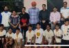 Basketball players posing for a group photograph with dignitaries at Jammu on Wednesday.
