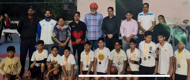 Basketball players posing for a group photograph with dignitaries at Jammu on Wednesday. Basketball players posing for a group photograph with dignitaries at Jammu on Wednesday.