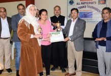 A winner being awarded with trophy by dignitaries at SKUAST-Jammu on Friday.