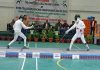Fencers in action during a bout.