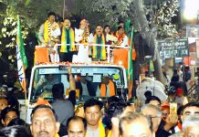 Union Minister Dr Jitendra Singh leading a series of road shows during the MCD election campaign at Delhi, on Wednesday.