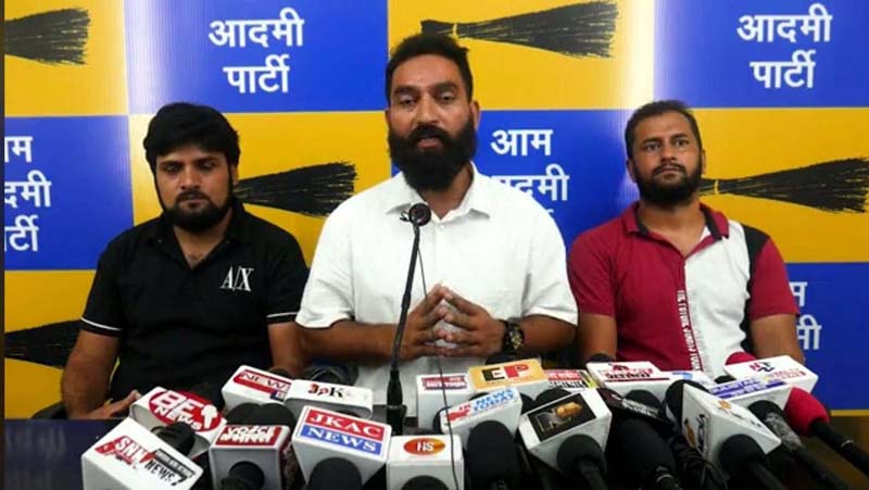 AAP senior leader Mehraj Malik addressing a press conference on Sunday. AAP senior leader Mehraj Malik addressing a press conference on Sunday.