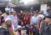 Chairman DAP Ghulam Nabi Azad and people posing for photograph.