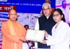 Uttar Pradesh Chief Minister Yogi Adityanath distributing appointment letters to staff nurses selected for all 75 districts by the Uttar Pradesh Public Service Commission (UPPSC) at Lok Bhavan, in Lucknow on Sunday. (UNI)