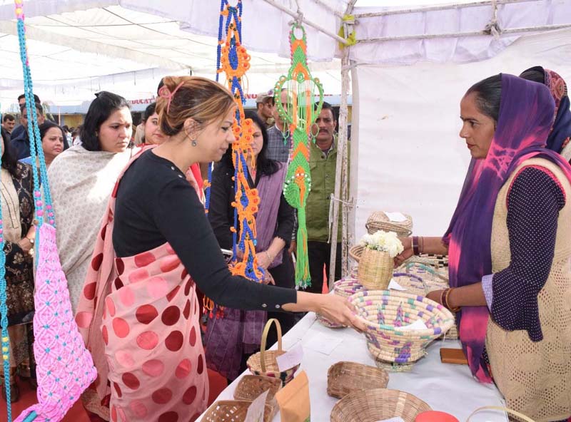 page8 Secretary Cooperative Yasha Mudgal inspecting a stall.
