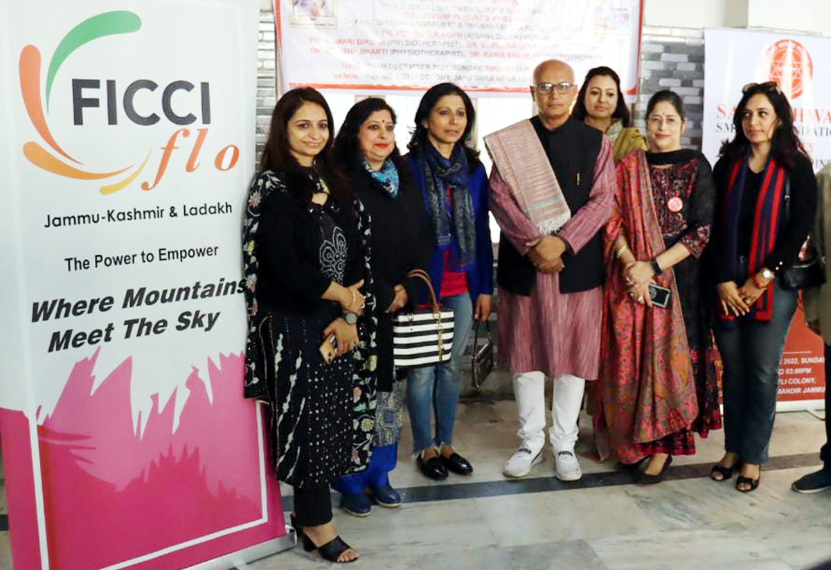 JMC Mayor, Rajinder Sharma poses for a group photograph with FICCI FLO team during a medical camp in Jammu on Monday.
