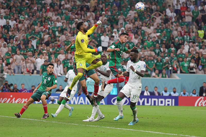Mohammed Alowais, goalkeeper of Saudi Arabia, tries to make a save during the match against Mexico at Lusail Stadium in Qatar. (UNI)