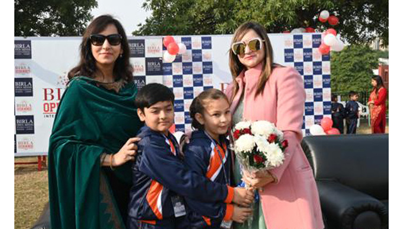 Chief guest being awarded with bouquet by children at BOMIS Jammu on Friday.