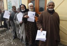 Old age pensioners wait for online registration in Srinagar. -Excelsior/Shakeel