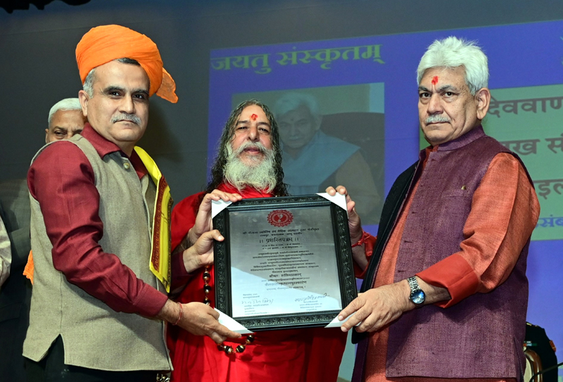 LG Manoj Sinha conferring Kailakh Sanskrit Ratna Award to DIG Shakti Pathak in Jammu on Tuesday. LG Manoj Sinha conferring Kailakh Sanskrit Ratna Award to DIG Shakti Pathak in Jammu on Tuesday.