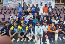 Selected teams players posing for a group photograph at MA Stadium Jammu on Tuesday.