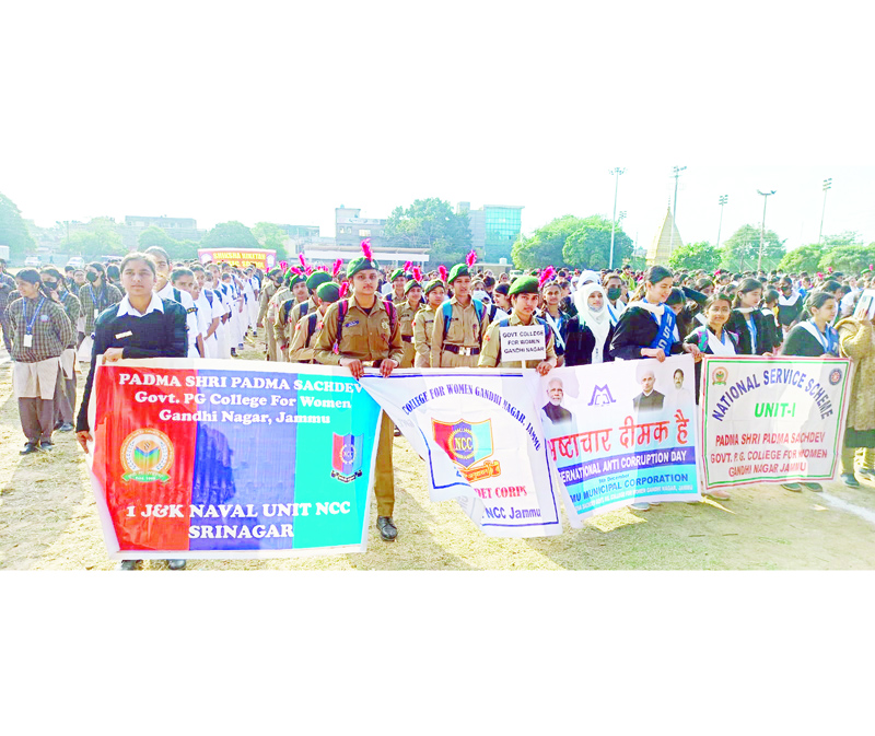 Students drawn from various institutes holding banners during Anti-Corruption Day at Parade Ground, Jammu on Friday. Students drawn from various institutes holding banners during Anti-Corruption Day at Parade Ground, Jammu on Friday.